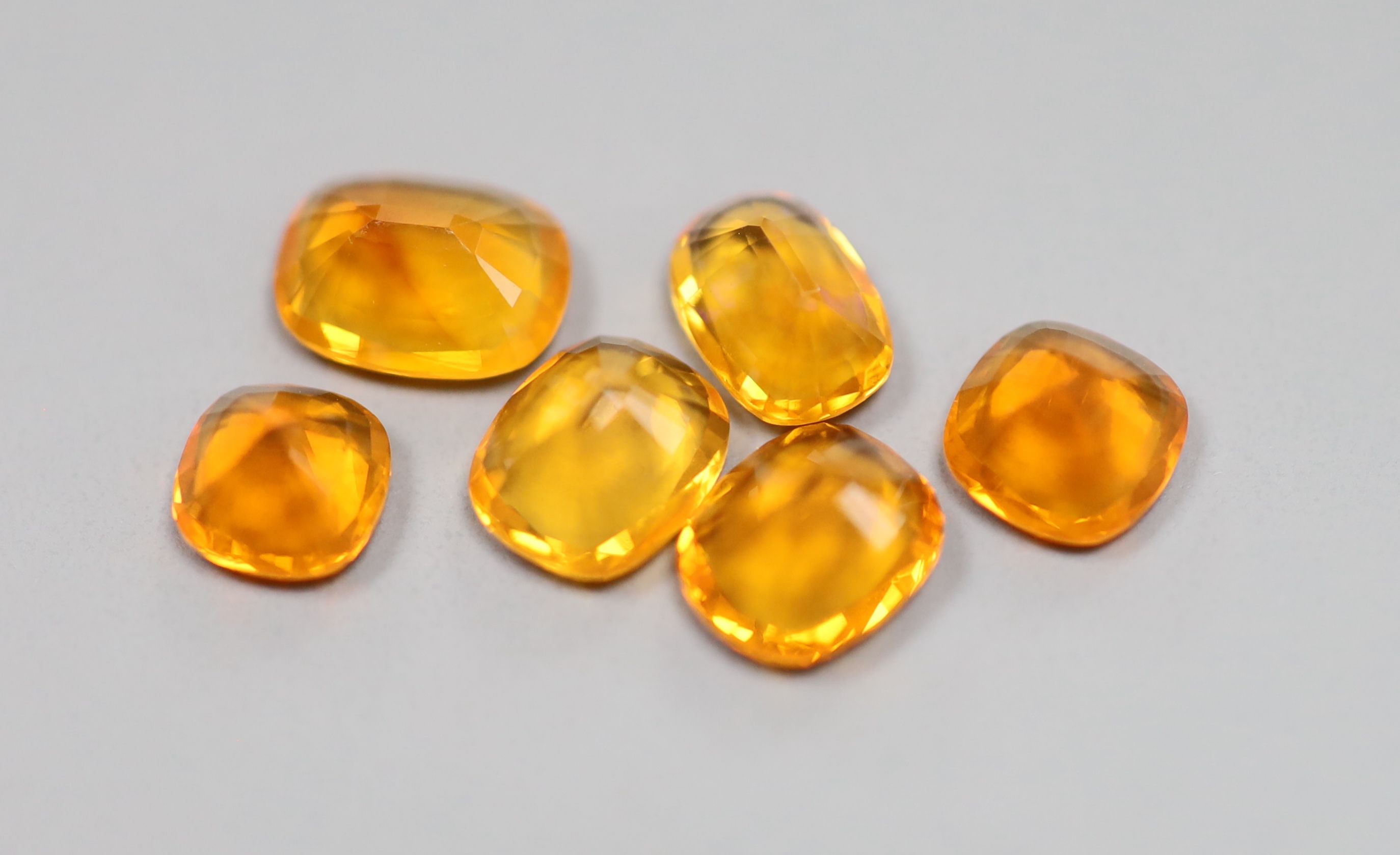 Six unmounted fire opals of varying cuts, with a total weight of approximately 4.00ct.